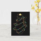 クリスマスツリーの光に照らされたサンタ黒猫 カード (黄色い花)