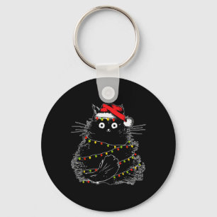 クリスマスツリーの光に照らされたサンタ黒猫 キーホルダー