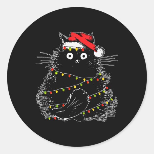 クリスマスツリーの光に照らされたサンタ黒猫 ラウンドシール (正面)