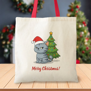 クリスマスツリーの前の怒ったグレー+タビー猫 赤い帽子 トートバッグ