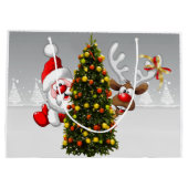 クリスマスツリーの後ろのサンタクロースとトナカイ.j ラージペーパーバッグ (裏面)