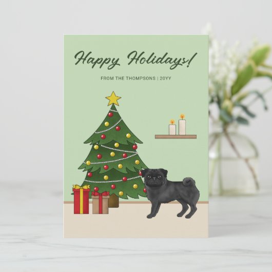クリスマスツリーを持つブラックパグかわいい漫画の犬 シーズンカード (スタンド正面)