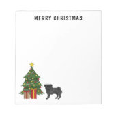 クリスマスツリーを持つブラックパグかわいい漫画の犬 ノートパッド (正面)