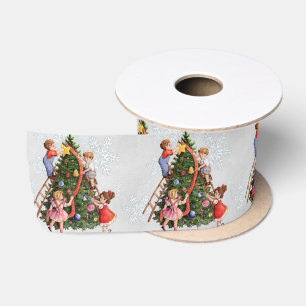 クリスマスツリーを飾っている子供 サテンリボン