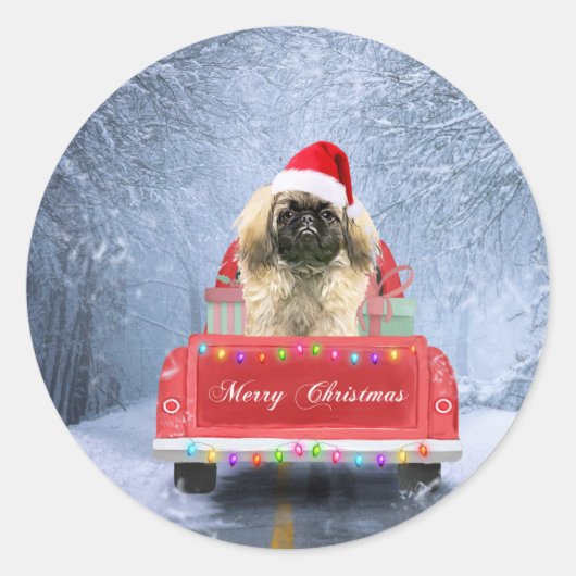 クリスマストラックに座って雪の中の北京犬 ラウンドシール (正面)