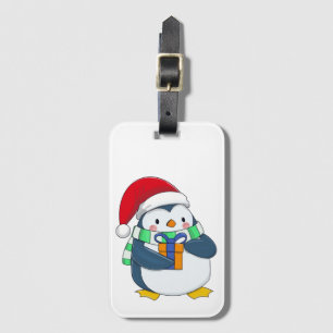 クリスマスハットにギフトを入れたペンギン ラゲッジタグ
