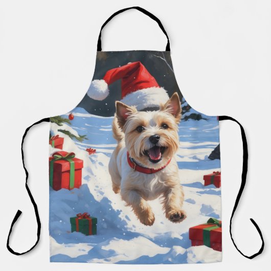 クリスマスハットをかぶったケアン・テリアの雪中での奔走 エプロン (正面)