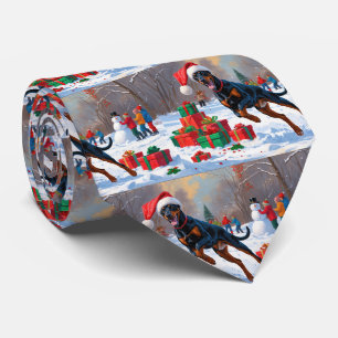 クリスマスハットをかぶったドーベルマンが雪の中を走る ネクタイ