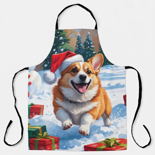 クリスマスハットをかぶって雪の中を走るコーギー エプロン (正面)