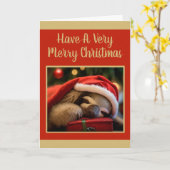 クリスマスハットクリスマスを着て眠る怠け者 カード (黄色い花)