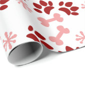 クリスマスピンクの赤い犬の猫が骨の雪のかけらを歩く ラッピングペーパー (ロールコーナー)