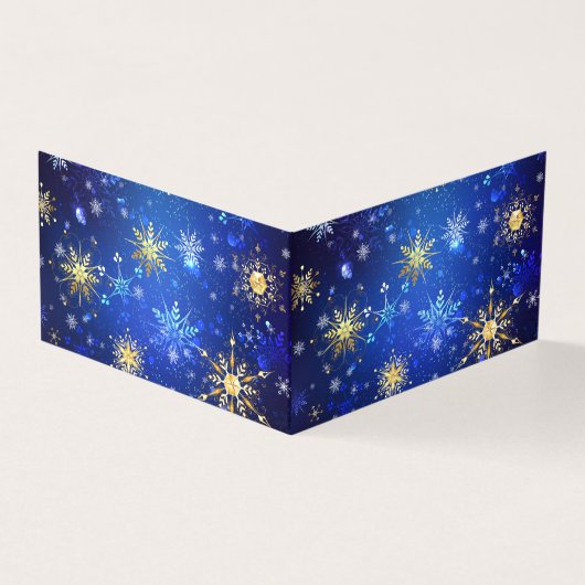 クリスマスブルーバックグラウンドと黄金の雪片 (外部)