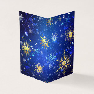 クリスマスブルーバックグラウンドと黄金の雪片 名刺
