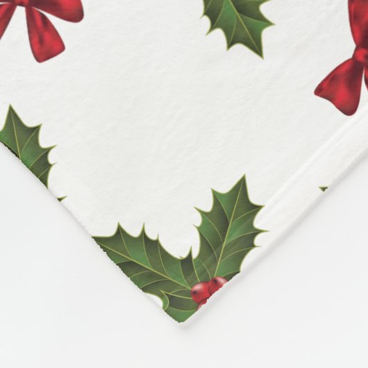 クリスマスプレゼントのホリー植物と赤い弓のパターン フリースブランケット (角)