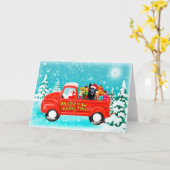 クリスマスプレゼントを積んだドイツシェパード犬の配達トラック カード (黄色い花)