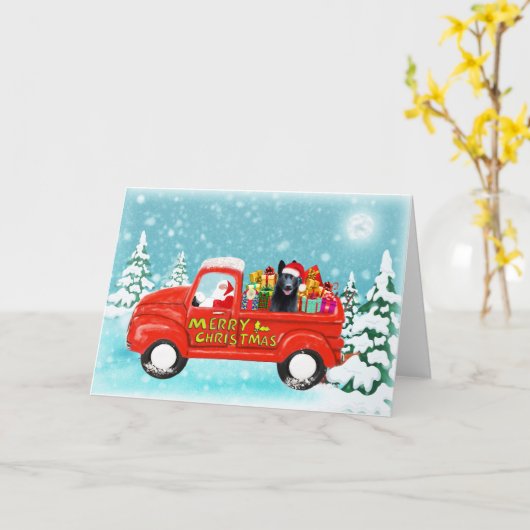 クリスマスプレゼントを積んだドイツシェパード犬の配達トラック カード (黄色い花)