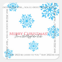 クリスマスモダンのキラキラした青い降雪の結晶