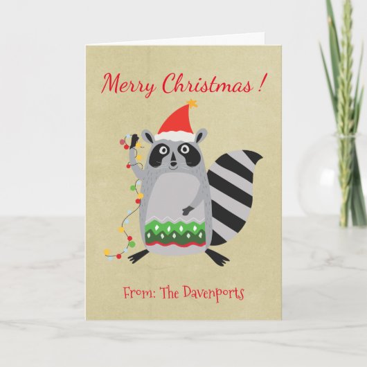 クリスマスライトでもつれるサンタの帽子のアライグマ シーズンカード (正面)