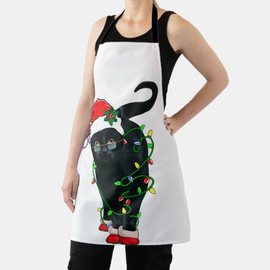 クリスマスライトに黒猫サンタがもつれた エプロン (インサイチュ)