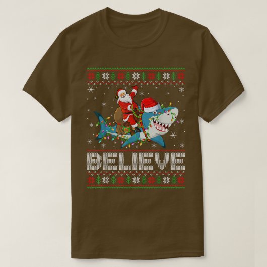 クリスマスライトシャーク信じ醜いサンタライディングサメ Tシャツ (デザイン正面)