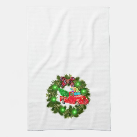 クリスマスリースを走る赤いトラック キッチンタオル (縦)