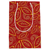 クリスマスレッドと金ゴールド図解入りの、写真付きののパターン ミディアムペーパーバッグ (正面)