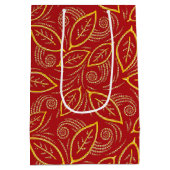 クリスマスレッドと金ゴールド図解入りの、写真付きののパターン ミディアムペーパーバッグ (裏面)