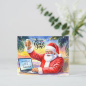 クリスマス休暇に向けてサンタがオンラインで作業中 シーズンポストカード (スタンド正面)