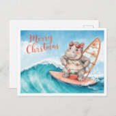 クリスマス休暇中のサーフボードに乗ったカバ シーズンポストカード (正面/裏面)