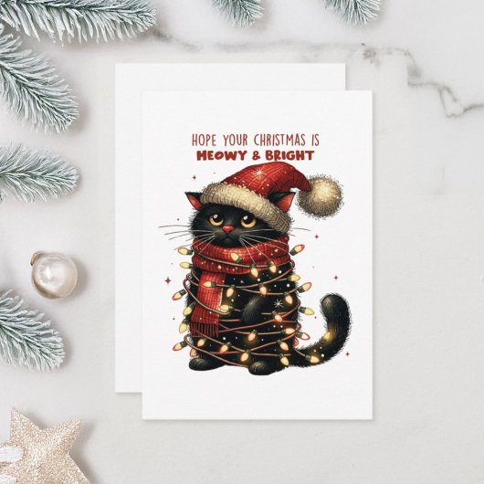 クリスマス包まれたの明かりが付いた可愛い猫。 カード