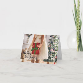 クリスマス包まれたツリーにプレゼントを持つ女の子 カード