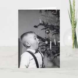クリスマス吹の木にろうそくを消した小さな少年 シーズンカード