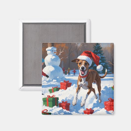 クリスマス帽をかぶった雪の中を走るグレイハウンド マグネット (正面/裏面)