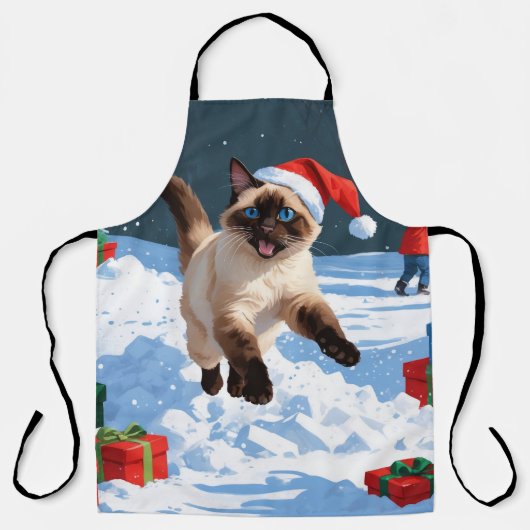 クリスマス帽をかぶった雪の中を走るシャム猫 エプロン (正面)