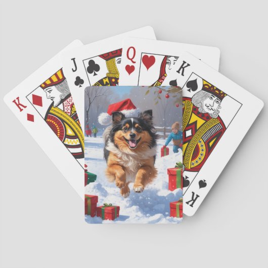クリスマス帽子をかぶったケースホンドの犬が雪の中を走る トランプ (裏面)