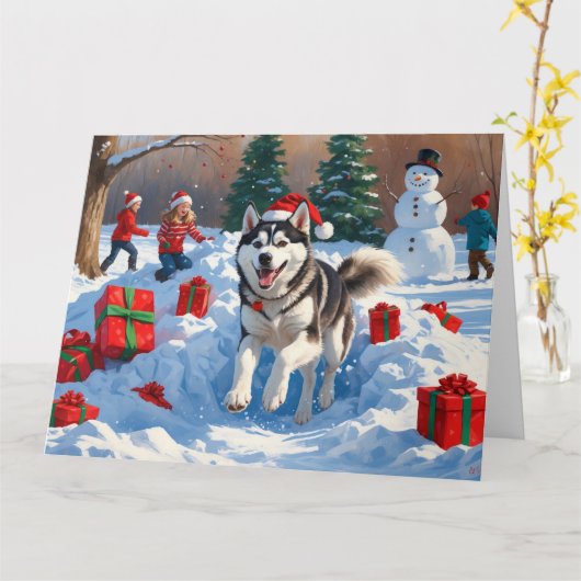 クリスマス帽子をかぶったシベリアンハスキーの雪中でのランニング カード (黄色い花)