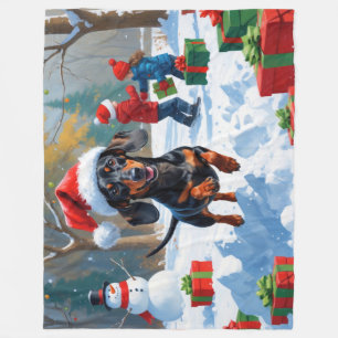 クリスマス帽子をかぶったダックスフンドの雪の中のラン フリースブランケット
