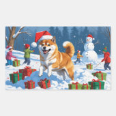 クリスマス帽子をかぶって雪の中を走る柴犬 長方形シール (正面)