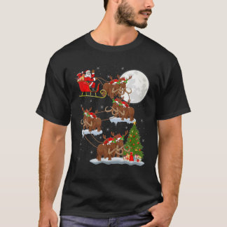 クリスマス照明ツリーサンタライディングウーリーマンモスチャール Tシャツ
