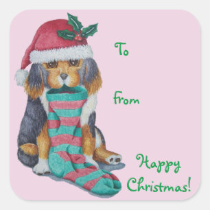 クリスマス用の服を着たかわいい黒と茶色の子犬 スクエアシール