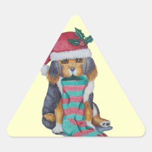 クリスマス用の服を着たかわいい黒と茶色の子犬 三角形シール