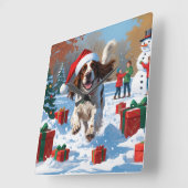 クリスマス走ハットで雪の中のイギリスのセッター スクエア壁時計 (傾斜)