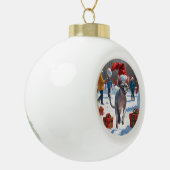 クリスマス走ハットで雪の中のスフィンクス猫 セラミックボールオーナメント (左)