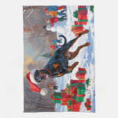 クリスマス走ハットで雪の中のドーバーマンの帽子 キッチンタオル (縦)