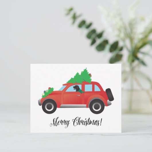 クリスマス車を運転している平ら上塗を施してあるレトリーバー犬 シーズンポストカード (スタンド正面)