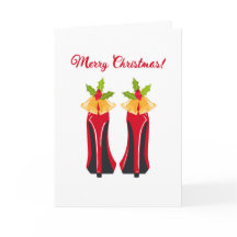 クリスマス鐘の折られたカードが付いている赤いハイヒール