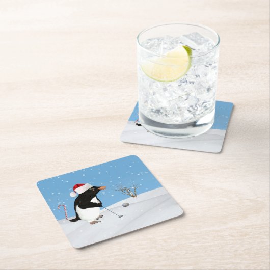 クリスマス、ゴルフを遊んでいるペンギン スクエアペーパーコースター (インサイチュ)