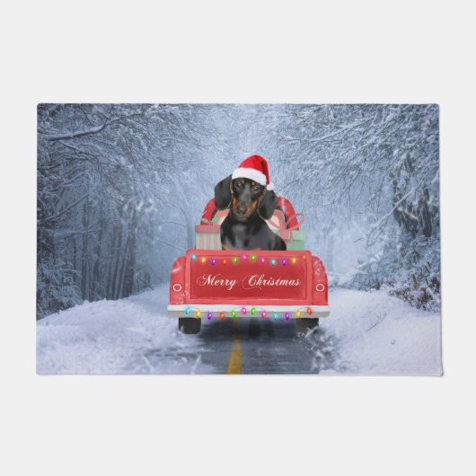 クリスマス・トラックに座って雪の中のダシュント犬 ドアマット (正面)