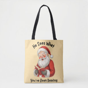 クリスマス ブック愛好家のための「彼はあなたが何を読んでいるかわかっている」デザイン トートバッグ
