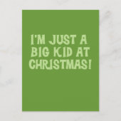 クリスマスTシャツとギフトを手にする大きな子ども シーズンポストカード (正面)